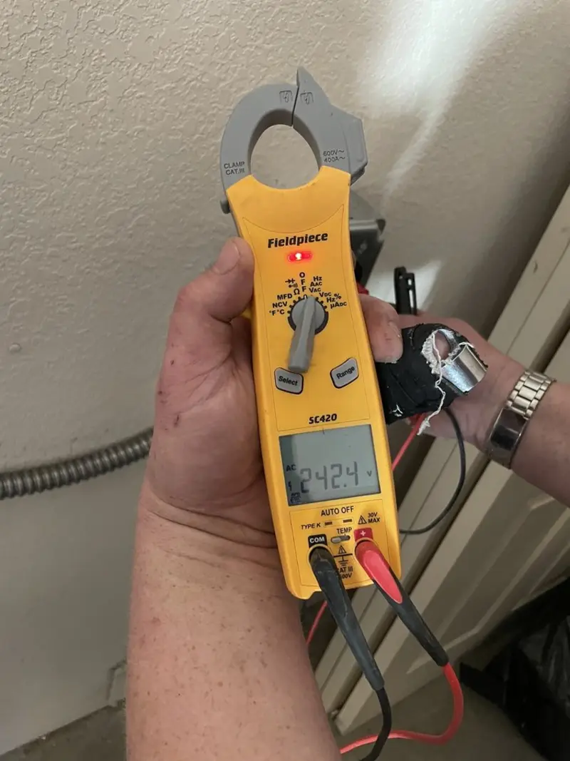 Voltage testing with clamp meter during Outlet Installation in Conemaugh